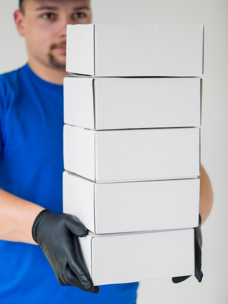 Close-up man wearing black gloves