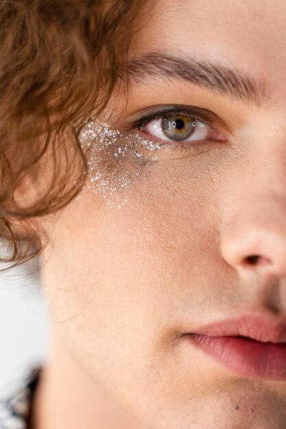 Close up man wearing glitter