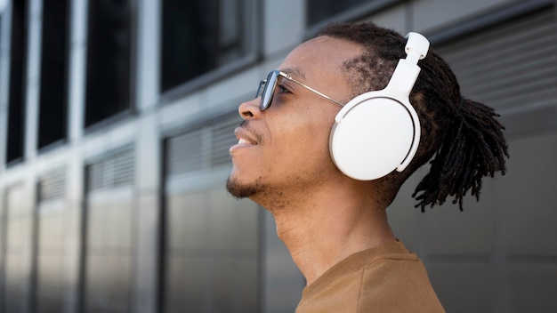 close up man wearing headphones
