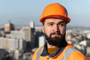 Free photo close up man wearing protection helmet