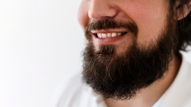 Close-up man with beard smiling