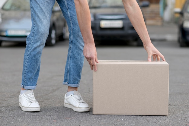 Free photo close-up man with box