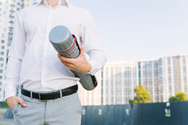 Free photo close-up man with building plans outdoors