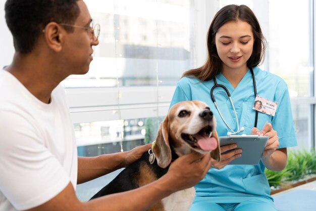 close up man with dog at clinic
