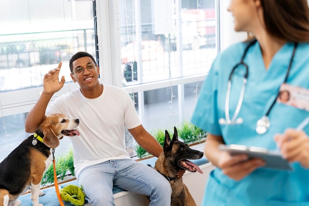 Close up man with dog at veterinarian checkup