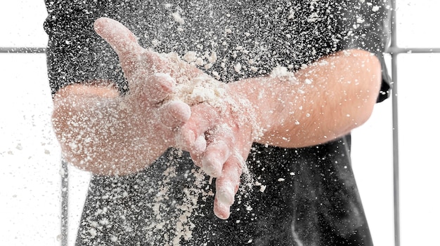 Close-up man with flour on hands