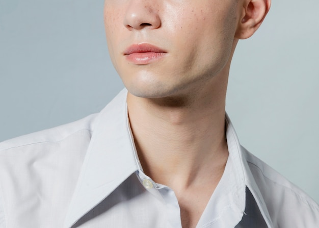 Close-up of man with opened button on shirt