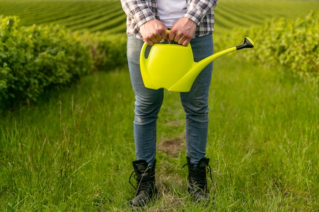 Close-up man with watering can