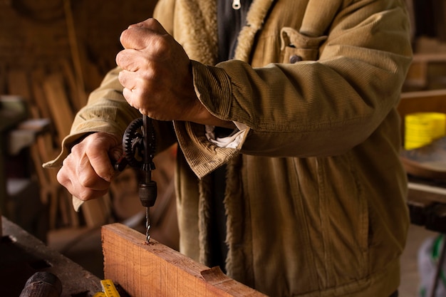 Close-up man working with drill