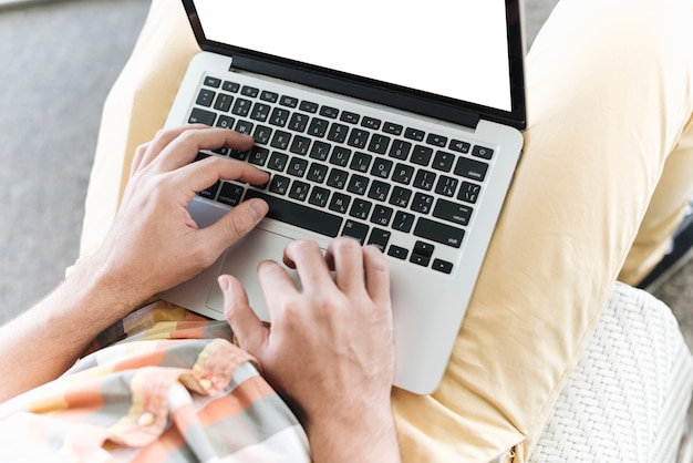 Close up of man working with laptop