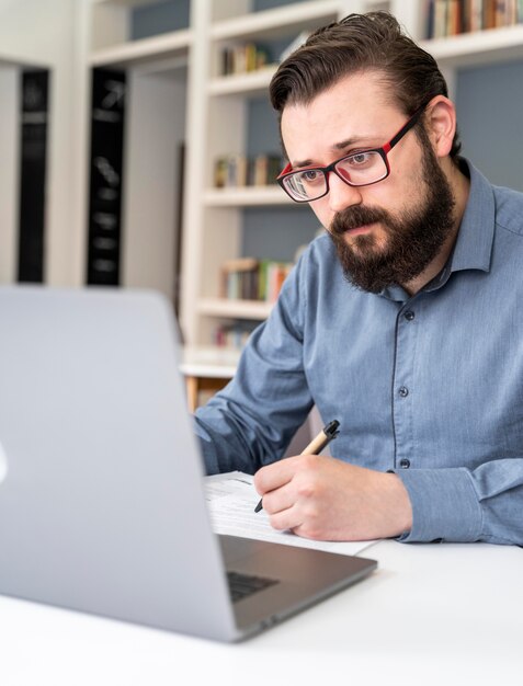 Close up man working with laptop