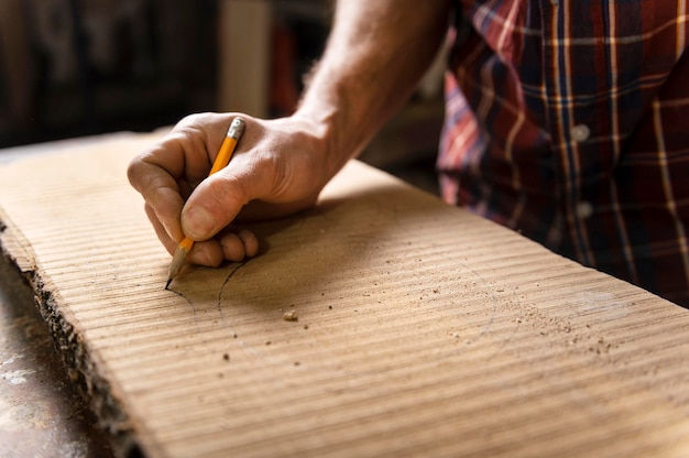 Close up man working with wood