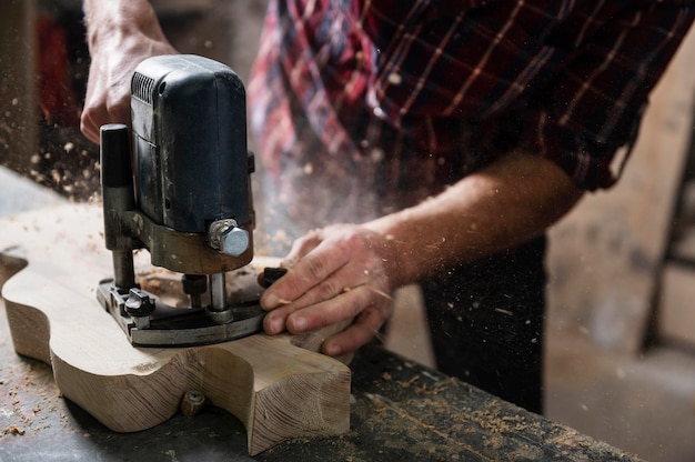 Close up man working with wood