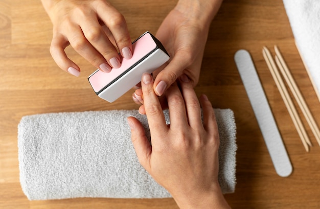 Close up manicure with nail file