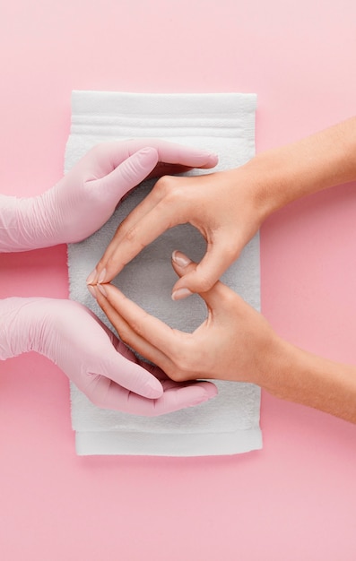 Free photo close-up manicurist and customer hands