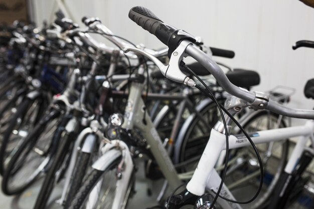 Close-up of many bicycles in workshop