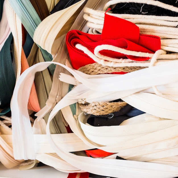 Free photo close-up of many zippers in tailor shop