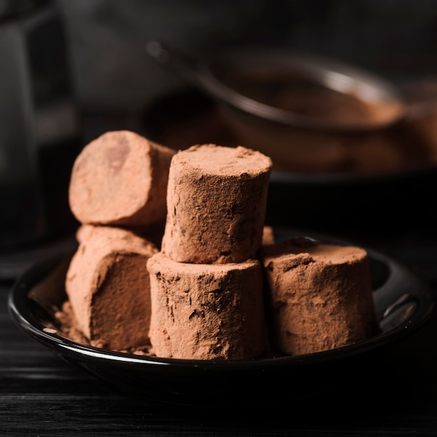 Close-up marshmallows covered in cocoa powder