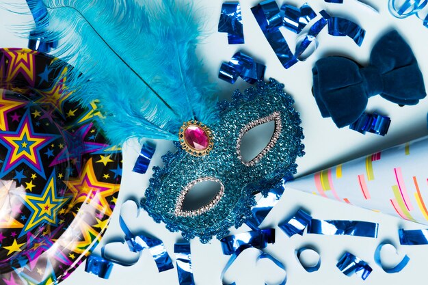 Close-up mask amidst party supplies