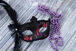 Free photo close-up mask with feather and beads