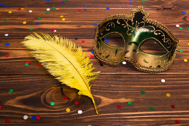 Free photo close-up mask and yellow feather