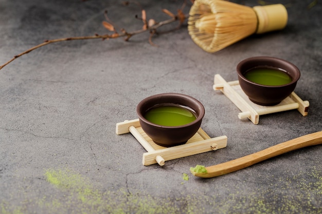 Close-up of matcha tea in cups with copy space