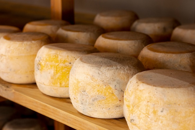 close-up matured cheese wheels