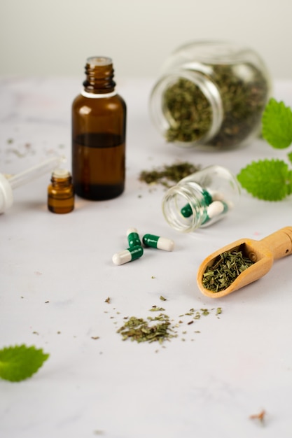 Close-up medical treatment with herbs on the table