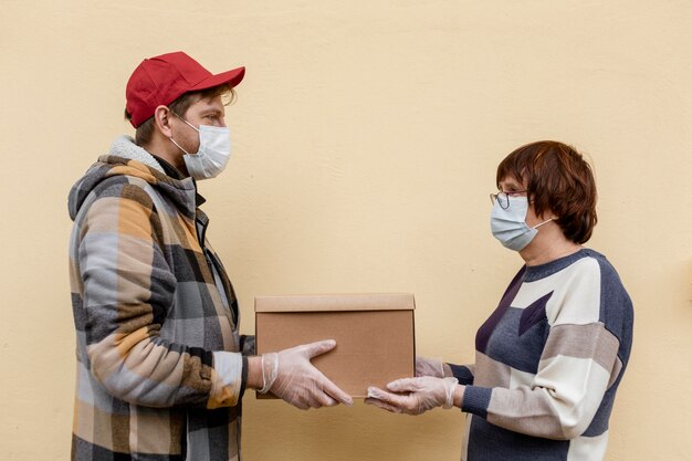 Close-up men holding box