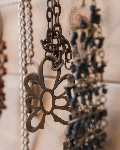 Close-up of metallic bracelet and chain