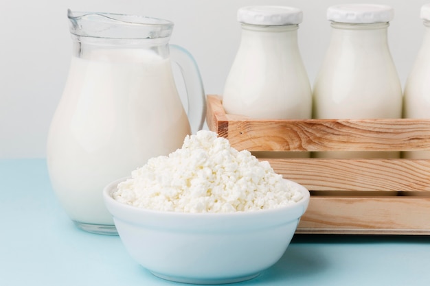 Close-up milk jug with fresh cottage cheese