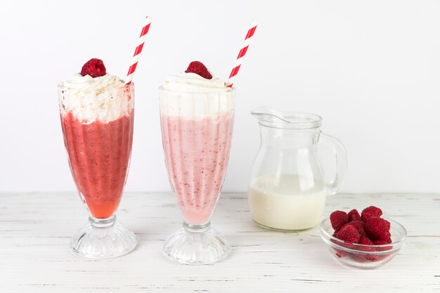 Close up milkshake glasses with whipped cream