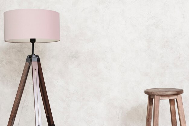 Close-up minimalist designer floor lamp and bar stool