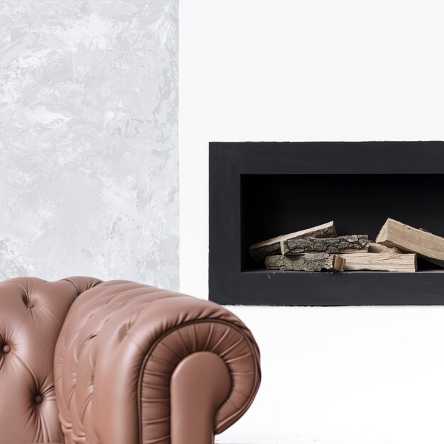 Close-up minimalist fireplace  and sofa