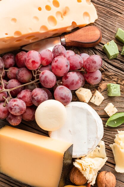 Close-up mix of cheese with grapes