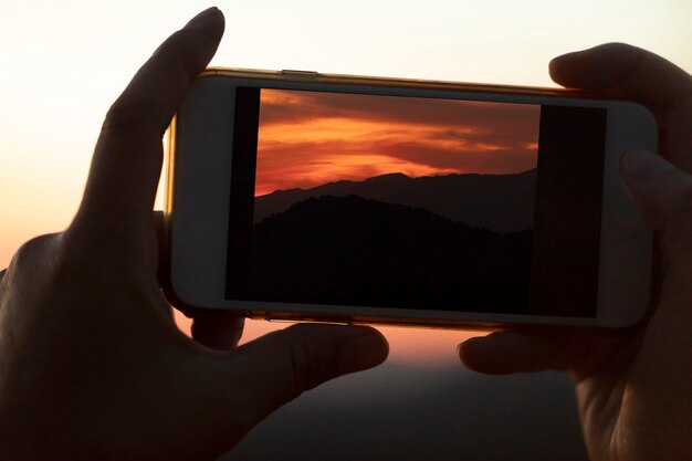 Close-up mobile phone being held by hands