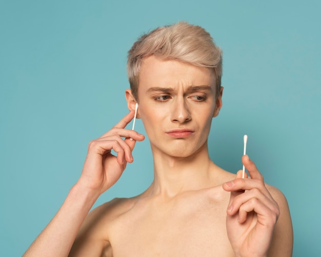 Close up model holding swabs