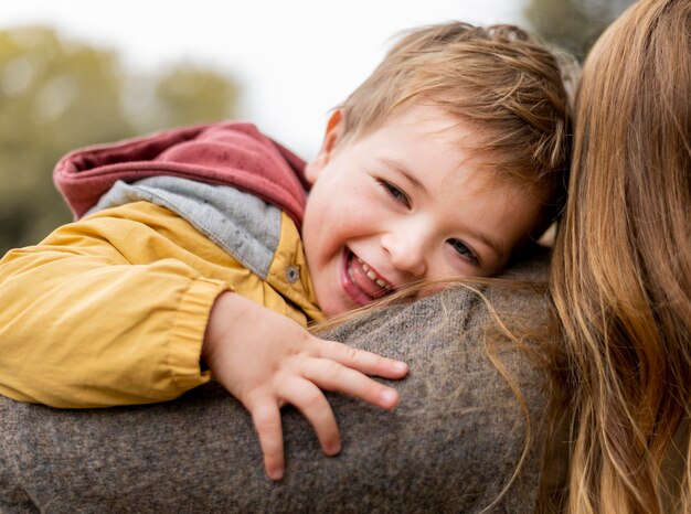 Close-up mother holding happy kid