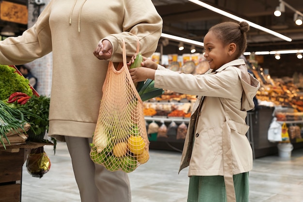 Close up mother and kid shopping