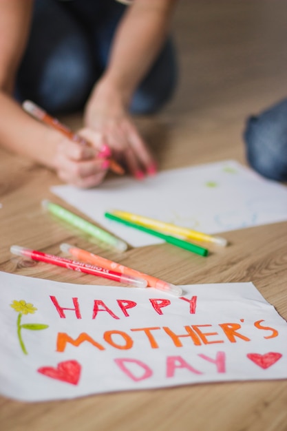 Close-up of mother's day poster on the floor