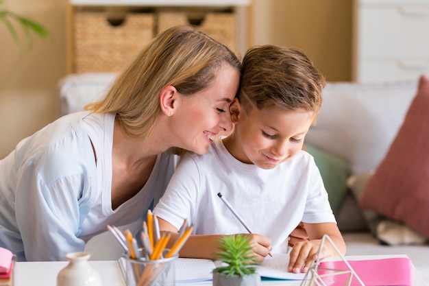 Close-up mother whisper words in child's ear