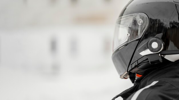 Close up motorcyclist with helmet