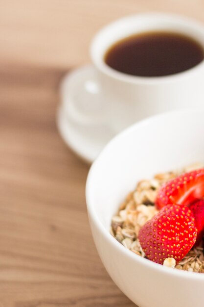 Close-up of muesli bowl and coffee