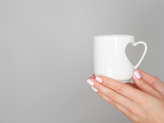 Close up mug with heart handle