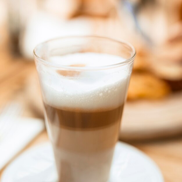 Close-up of multilayer coffee glass with foam