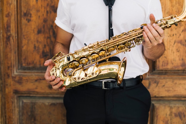 Close up musician holding the sax