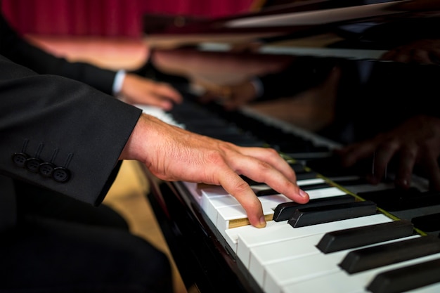 Close-up musician playing piano