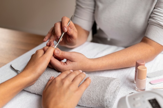 Close up nail care expert at job