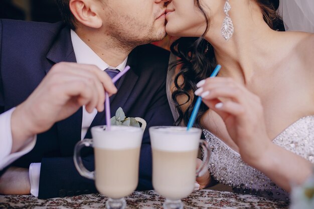 Close-up of newlyweds with drinks