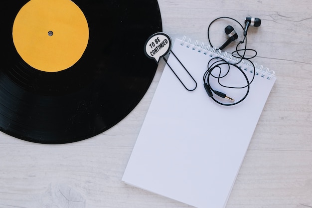 Close-up notebook near vinyl record